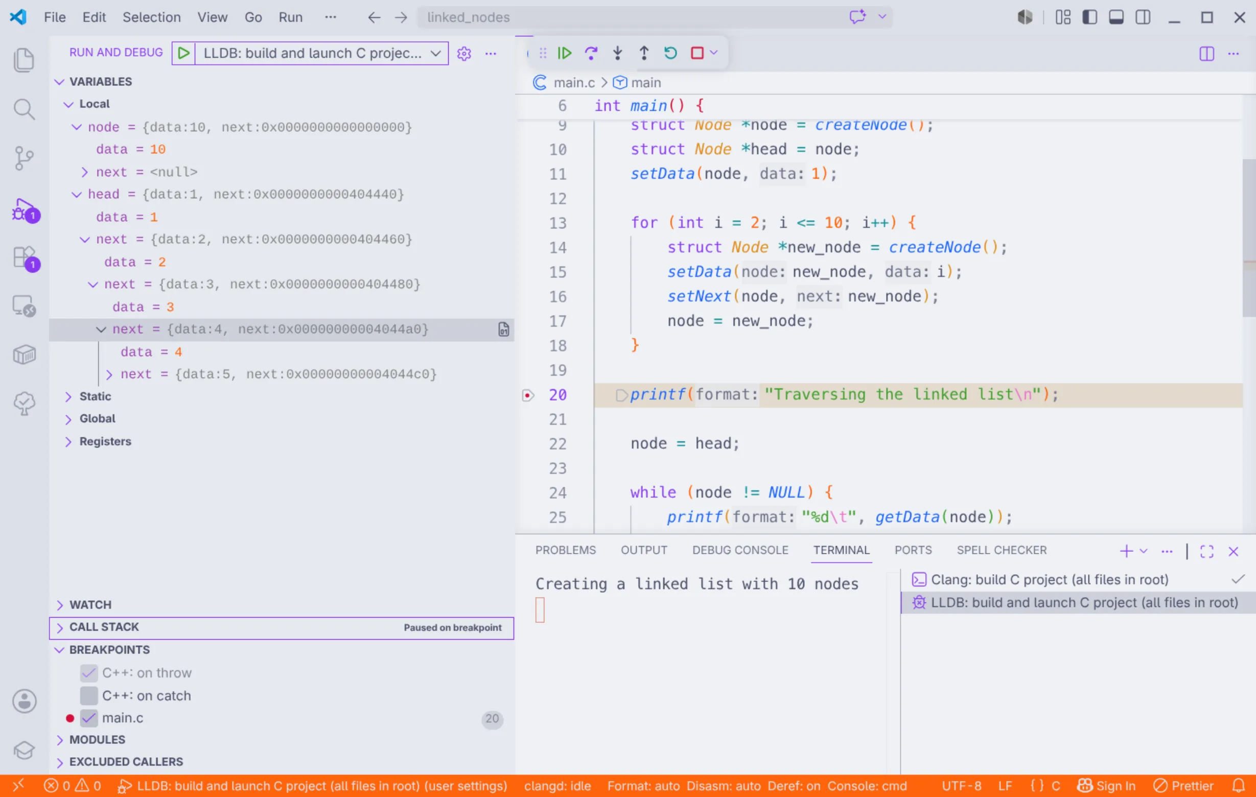Visual Studio Code depurando o arquivo "main.c", tendo pausado no breakpoint na linha 20.
